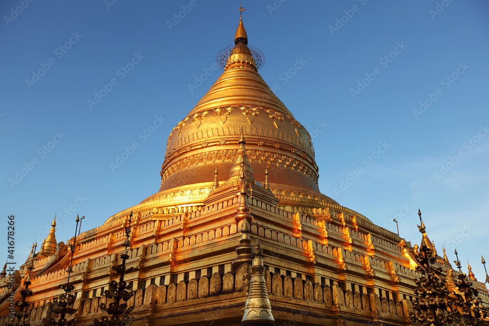 Shwezigon Pagoda sunlit and golden in Bagan, Myanmar