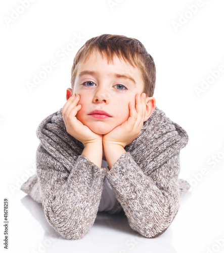 Cute boy lying on floor