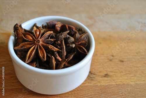 star anise in a small white bowl