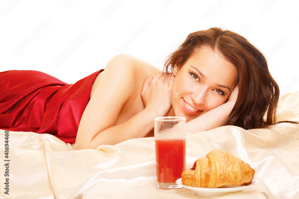 young girl with red shirt drinking a glass of orange juice young girl with red shirt drinking a glass of orange juice