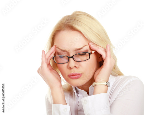 A businesswoman with a headache holding head
