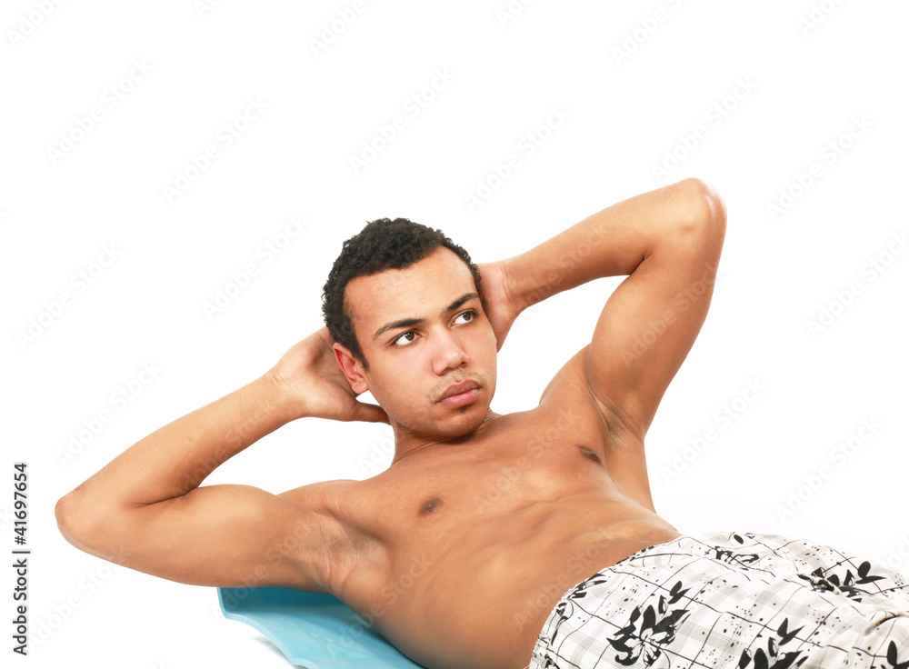 Fototapeta premium A young muscular man training