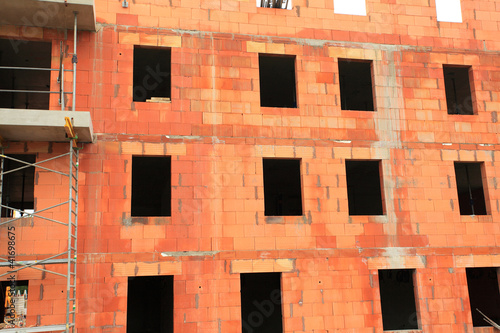 residential building under construction in red brick