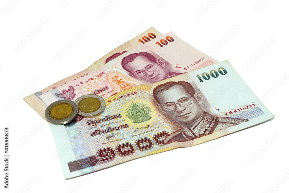 Thailand paper currency and coins isolated over white Thailand paper currency and coins isolated over white