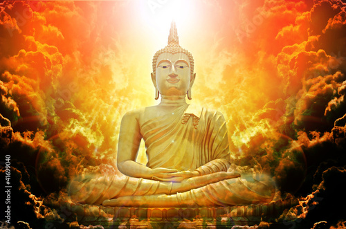 Canvas Print Buddha statue over scenic sunset sky background
