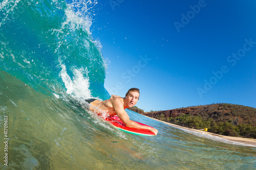 Body Boarder Surfing Blue Ocean Wave © EpicStockMedia