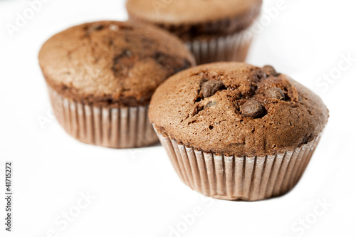 Chocolate muffins on the white background