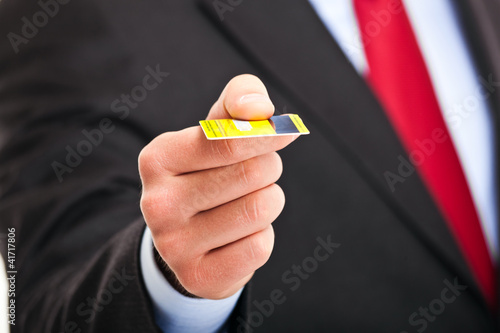 Businessman holding a credit card