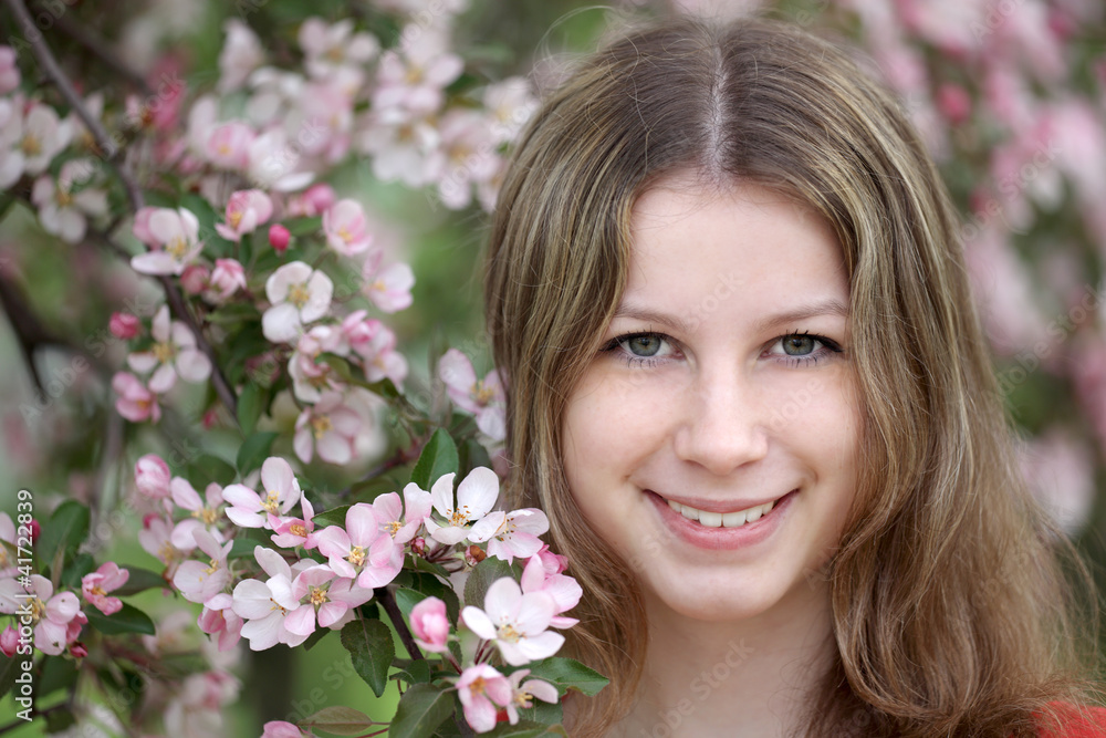 Portrait of the girl against a blossoming apple-tree Portrait of the girl against a blossoming apple-tree