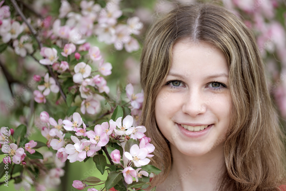 Portrait of the girl against a blossoming apple-tree Portrait of the girl against a blossoming apple-tree