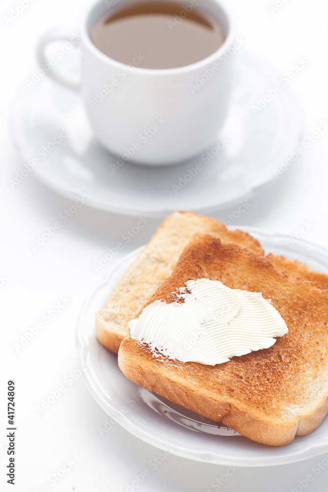 tea and toast with butter isolated on white tea and toast with butter isolated on white