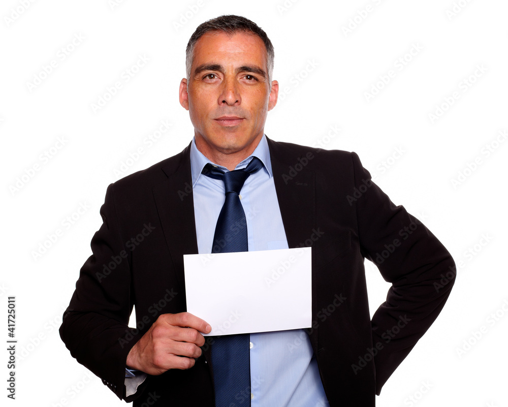 Hispanic senior business man holding a white card Hispanic senior business man holding a white card