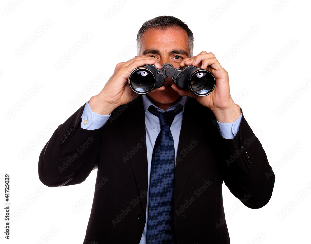 Senior man looking through binoculars Senior man looking through binoculars