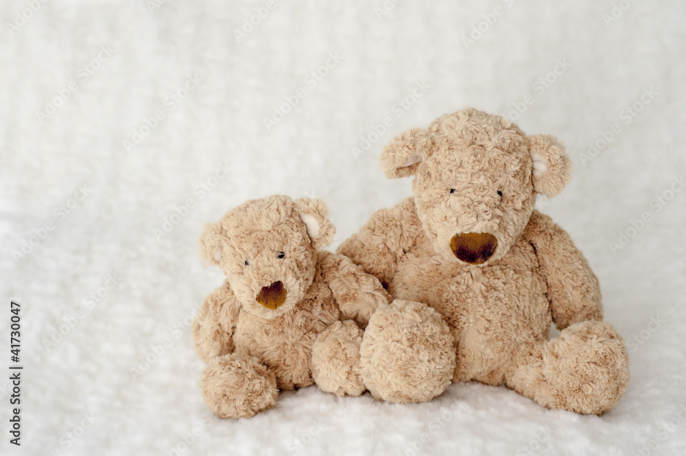 teddy bear seated on white carpet