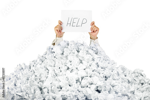 Billede på lærred Person under crumpled pile of papers with a help sign / isolated
