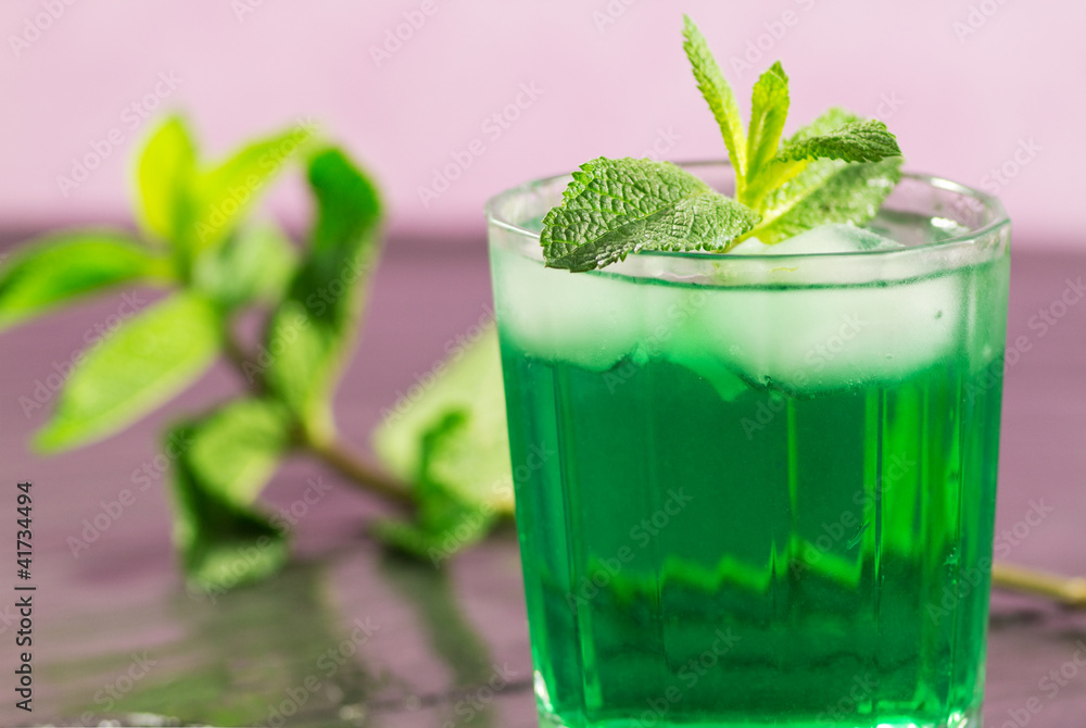 iced mint glass over pink background iced mint glass over pink background