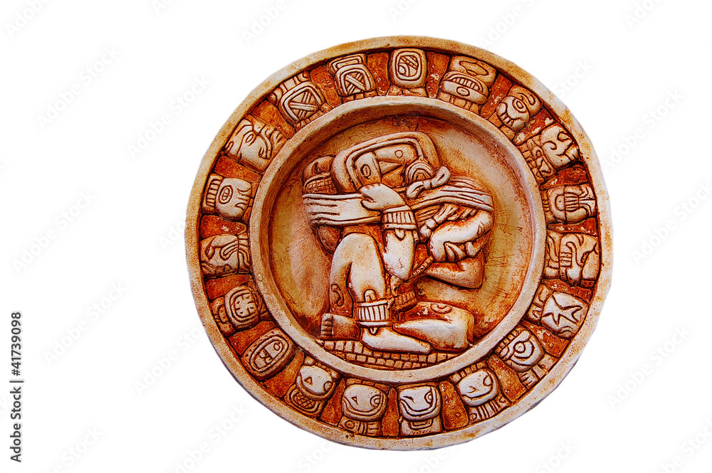 A carved Mayan calendar isolated on white A carved Mayan calendar isolated on white