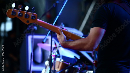 Guitarists in live action at a concert