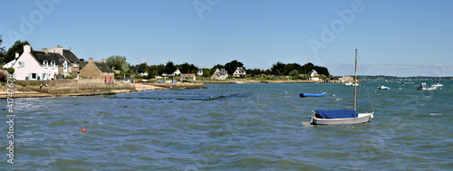 Boats on the coastline of Locmariaquer in France photo