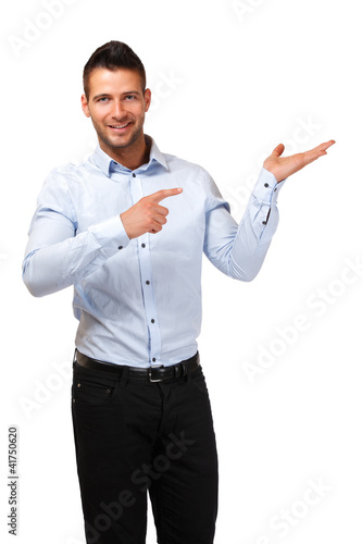 handsome businessman pointing at copyspace