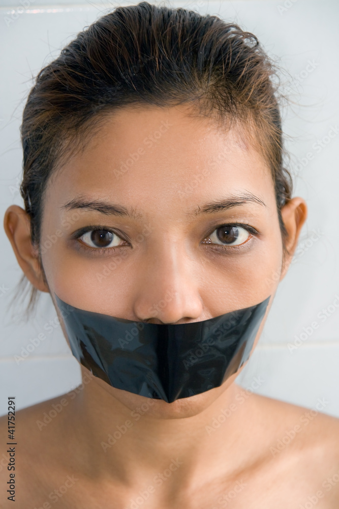 Young woman with mouth sealed.. Young woman with mouth sealed..