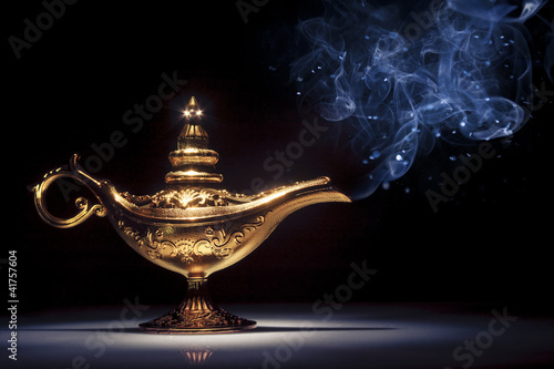 Magic Aladdin's Genie lamp on black with smoke