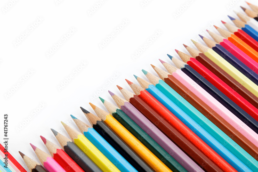 Colored pencils on a white background. Colored pencils on a white background.
