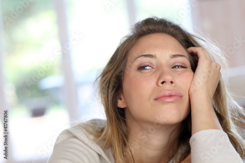 Portrait of blond woman with tired look