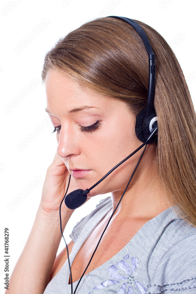 young woman talking on headset against a white background young woman talking on headset against a white background