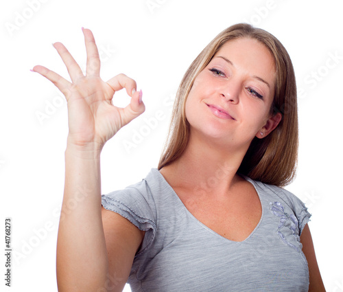 the girl shows gesture of approval to something