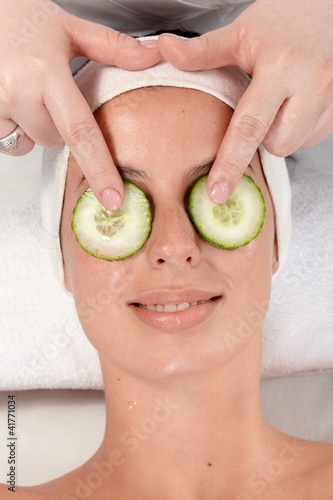 Natural beauty treatment with cucumber on eyes