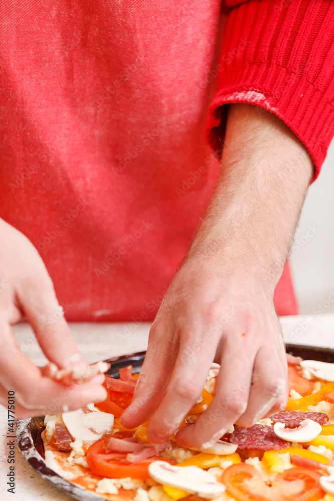 chef making pizza at kitchen chef making pizza at kitchen