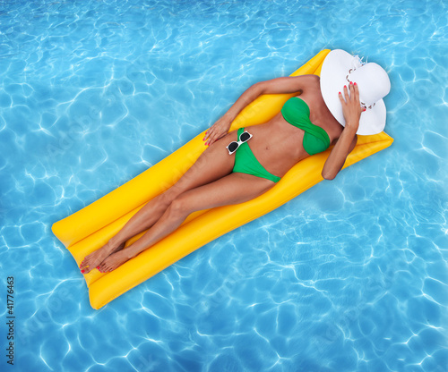 Woman relaxing in a pool