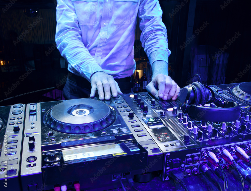 Obraz premium Dj mixes the track
