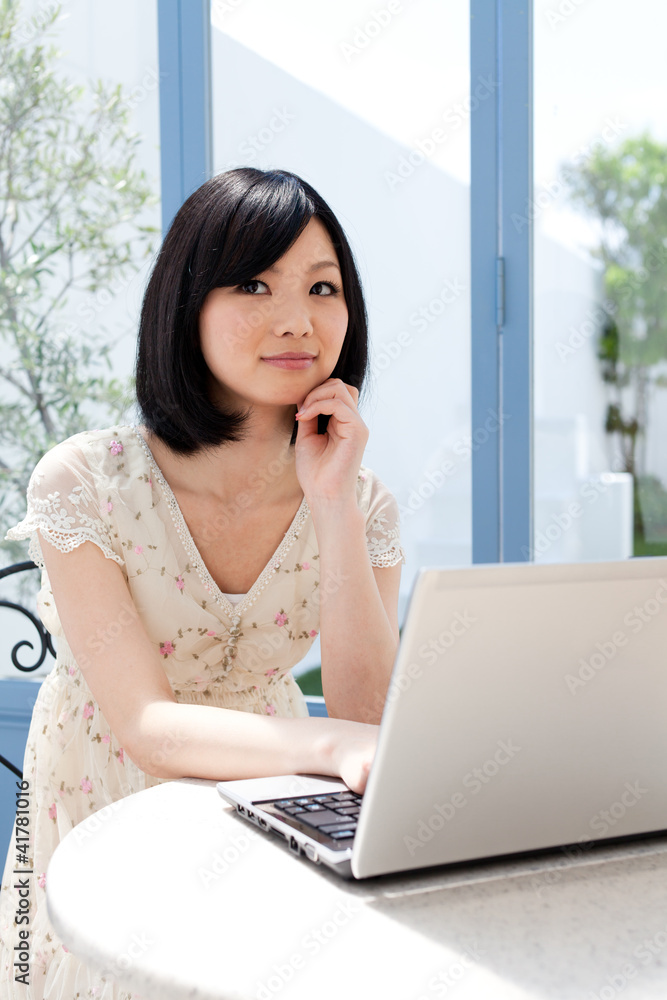 Beautiful young woman using a laptop computer. Portrait of asian Beautiful young woman using a laptop computer. Portrait of asian