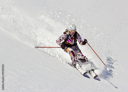 Woman skier in the soft snow