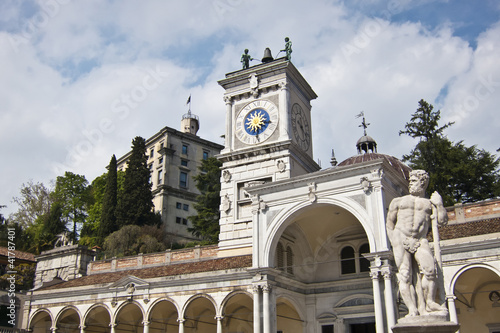 Clock Tower and statue in Piazza della Libertia, Udine, Italy photo