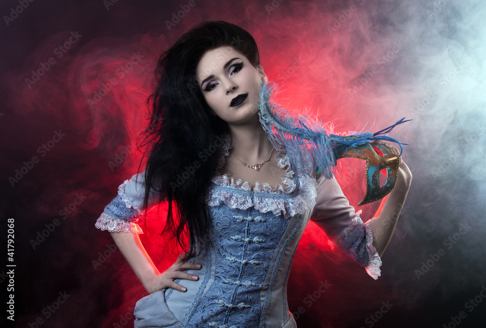 Beautiful Halloween vampire woman aristocrat over black-red back