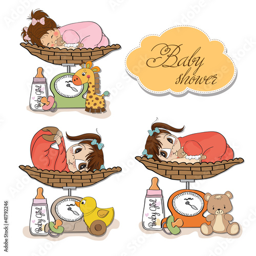 baby girl on on weighing scale, items set on white background