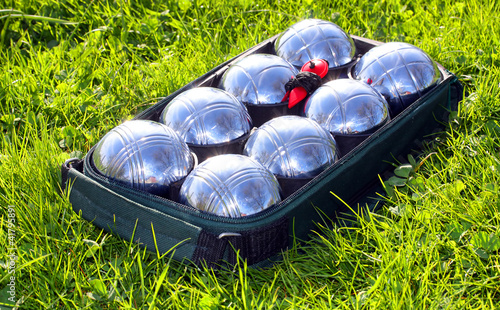 The bocce balls on a green grass. photo