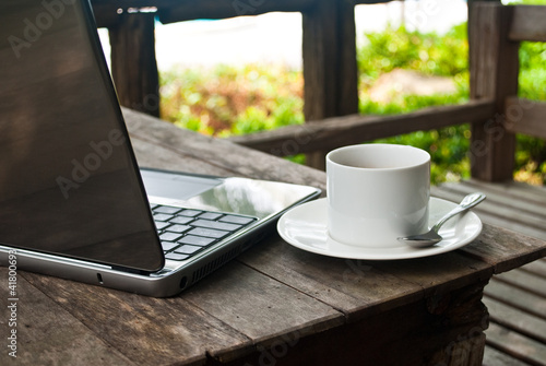 Coffee cup and laptop for business.