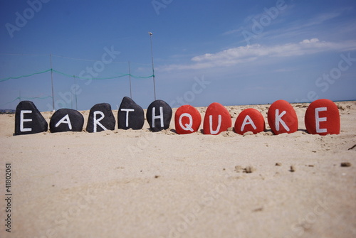 concept of earthquake on colourful stones on the sand