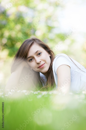 Female lying on grass