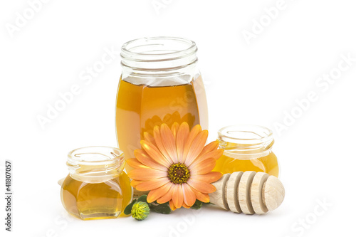 honey and flower on white