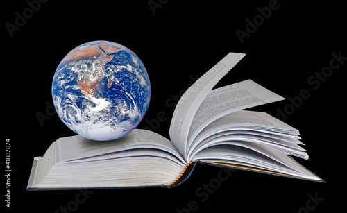 Planet Earth on book.Elements of this image furnished by NASA © Dmitry