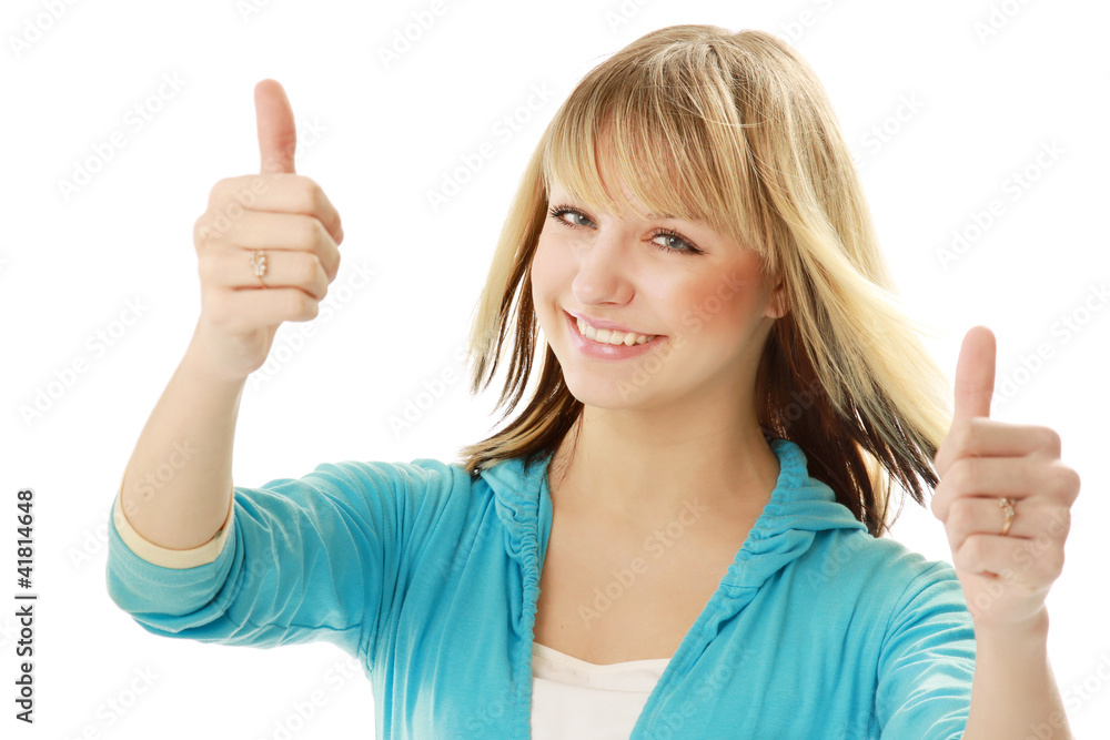 A smiling pretty girl with thumbs up shows sign A smiling pretty girl with thumbs up shows sign