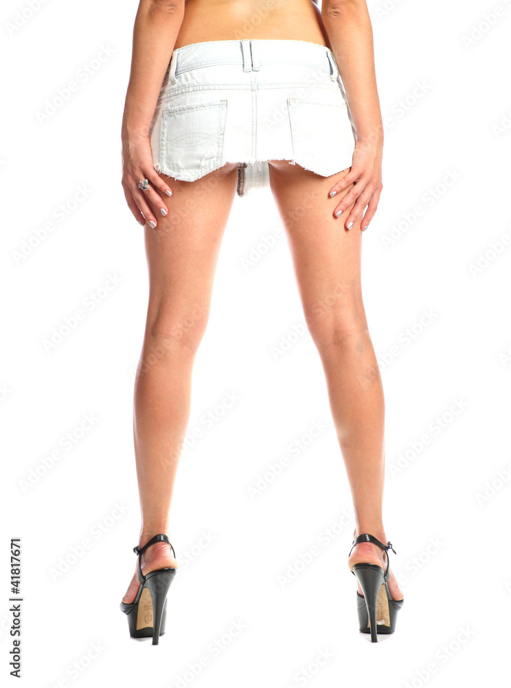 Sexy long female legs isolated white background Sexy long female legs isolated white background