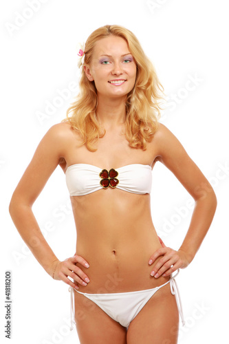A portrait of beautiful smiling woman in white swimsuit
