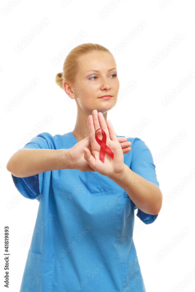 A female doctor showing a red ribbon as a symbol A female doctor showing a red ribbon as a symbol