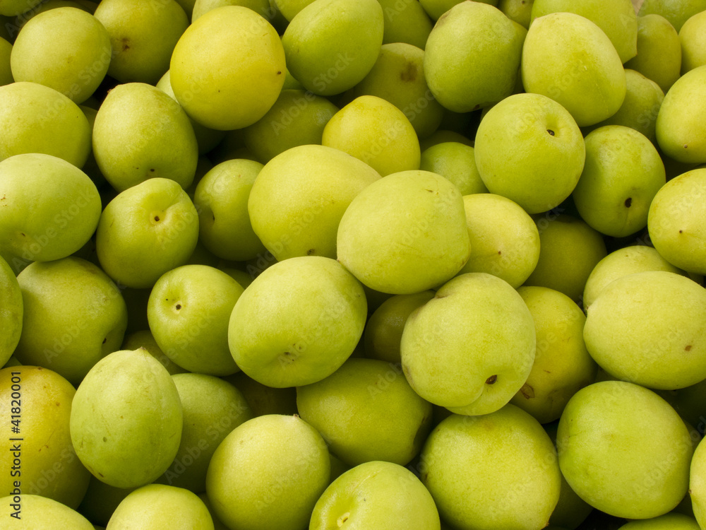 Heap group of many fresh green plum Heap group of many fresh green plum